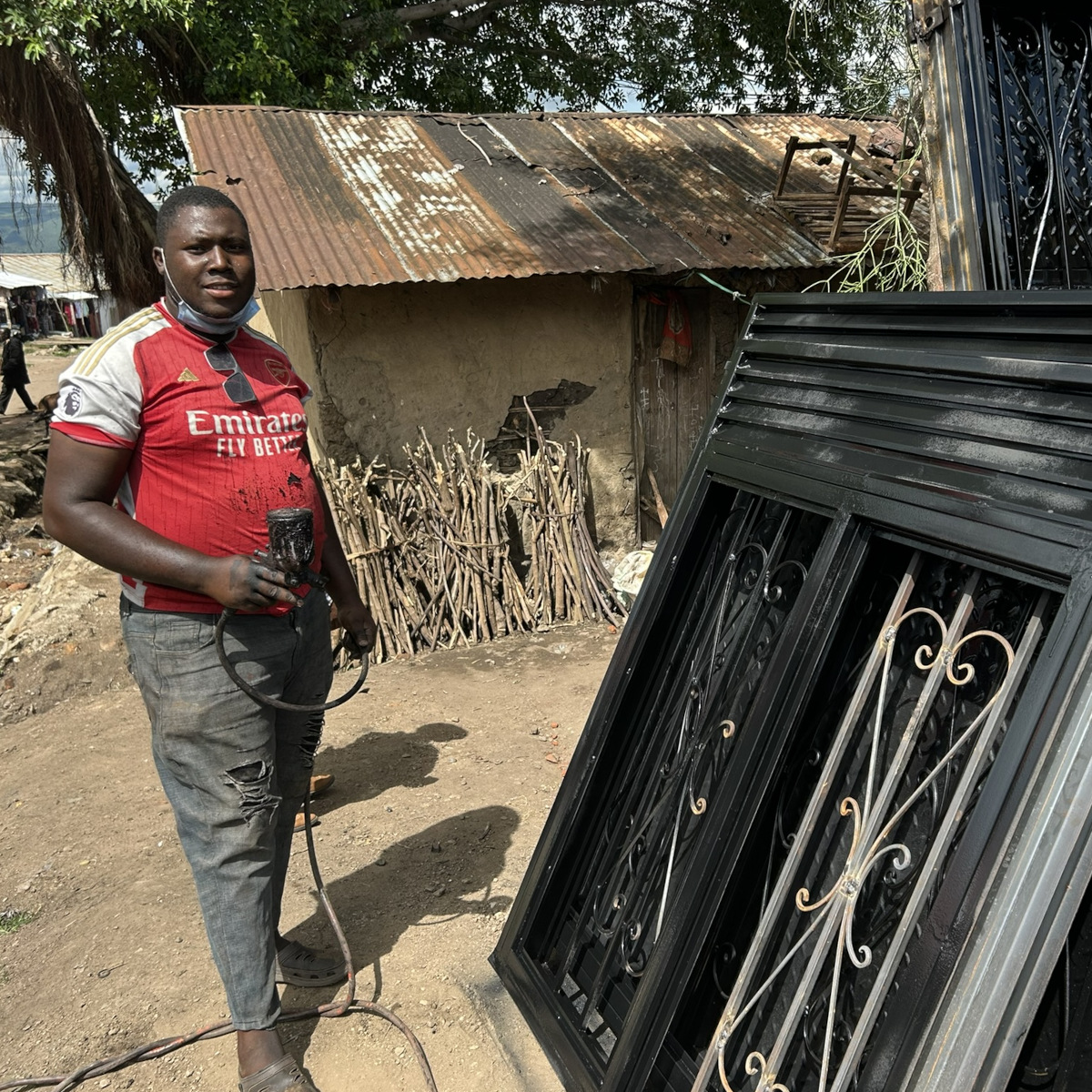 Jofus and the metal windows he fabricated