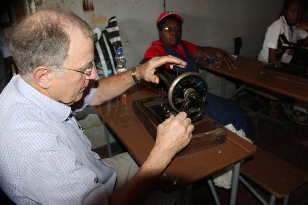 Roger with a manual sewing machine in Zambia